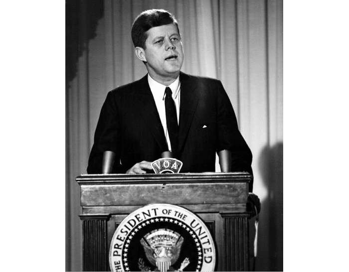 ST-45-4-61                                           13 March 1961  Reception for Latin American Diplomats, Officials, and Members of Congress. Medium close-up of President John F. Kennedy addressing the audience from podium; the President proposed the Alliance for Progress (Alianza para el Progreso), designed to promote economic cooperation between Latin American countries and the United States. East Room, White House, Washington, D.C.  Cecil Stoughton. White House Photographs. John F. Kennedy Presidential Library, Boston