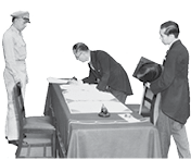 Japanese Foreign Minister Mamoru Shigemitsu signs the Instrument of Surrender on behalf of the Japanese Government, on board USS Missouri (BB-63), 2 September 1945. Lieutentant General Richard K. Sutherland, U.S. Army, watches from the opposite side of the table. Foreign Ministry representative Toshikazu Kase is assisting Mr. Shigemitsu. Photograph from the Army Signal Corps Collection in the U.S. National Archives.